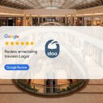 A digital rendering of a Google Review Card Free overlaying an empty, brightly lit shopping mall interior.